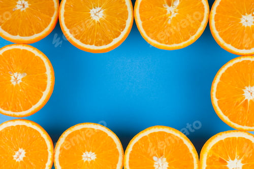 Preview: Cut Halves Of Juicy Orange On Blue Background. Orange Fruit, Citrus Minimal Concept. Creative
