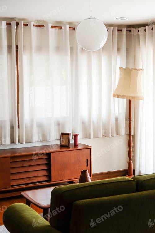 Preview: Interior of a modern living room with a green sofa and a coffee table