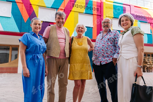 Preview: Group of senior friends meeting outddors in the city and having fun