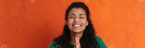 Preview: Happy young african woman in casual wear standing
