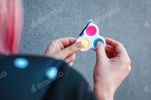 Preview: Cure of autism with focused games. Kids having fun with popular toy pop it.