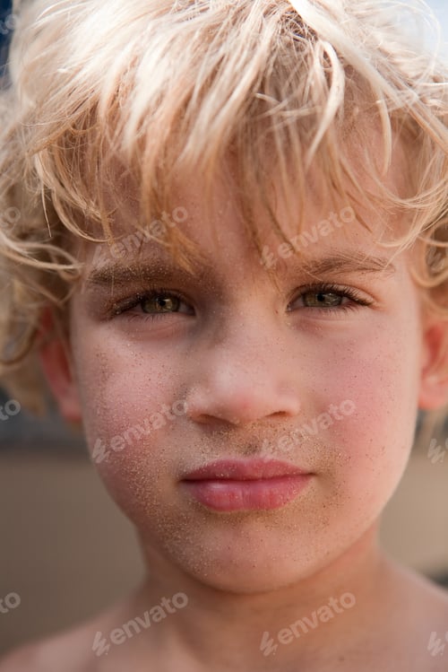Portrait of a Child with Sand on Face