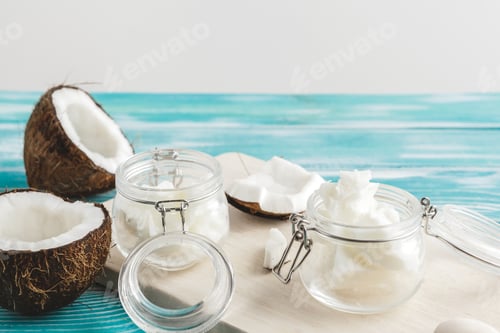 Preview: Coconut butter on wooden background. Organic healthy food concept