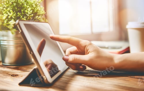 Preview: woman is working on tablet