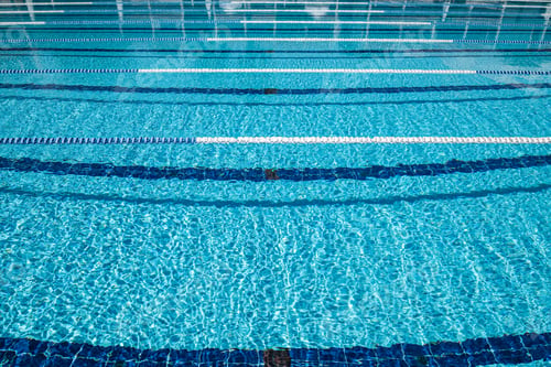 Preview: Olympic Swimming pool background on a bright Sunny day