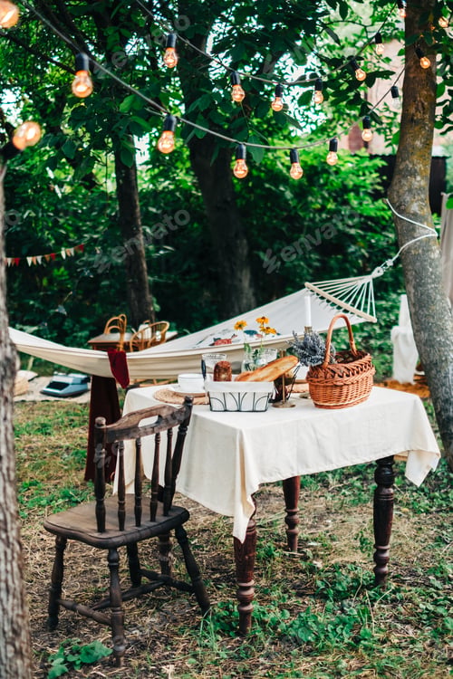 Preview: Dinner table in the backyard outdoors in countryside, nobody.