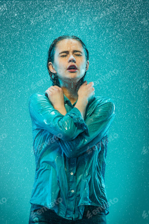 Preview: The portrait of young beautiful woman in the rain
