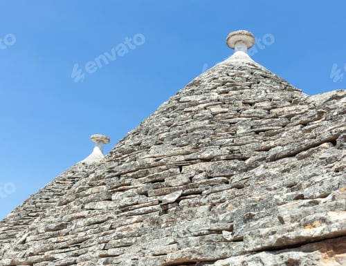 Preview: Trulli of alberobello showing typical conical stone roofs in puglia