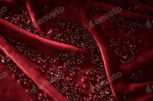 Preview: Abstract background from red beads on red velvet.