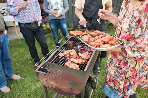 Preview: People enjoying barbecue party at yard