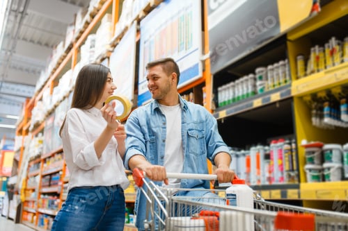 Preview: Couple with a cart buying building materials