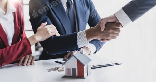 Preview: Good deal buy new house Cheerful young man bonding to his wife while shaking hand to man sitting in