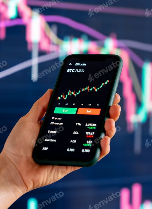 Preview: Smartphone displaying crypto trading app with financial charts in background