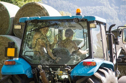 Preview: Men Working in the Field on a Tractor