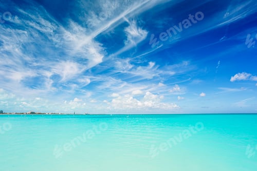 Preview: Idyllic tropical beach in Caribbean with white sand, turquoise ocean water and blue sky