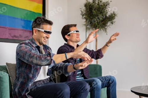 Preview: couple of men having fun with virtual reality glasses