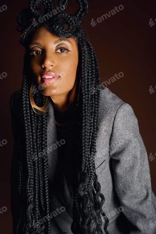 Preview: A young woman displays her stylish outfit and gorgeous braided hair in the studio.