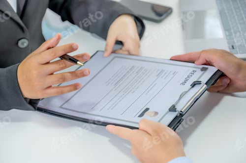 Preview: Office executives interviewing job applicants in the meeting room.