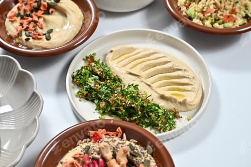 Preview: different plates filled with various foods on a table by some utensils