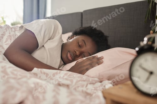 Preview: Woman resting in her bedroom