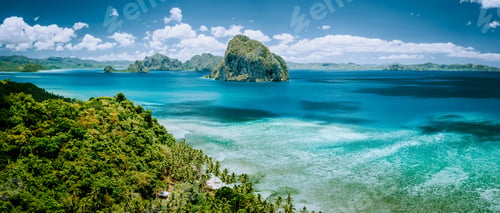 Preview: Panoramic aerial view of tropical Palawan island with unique Pinagbuyutan island on horizon. El Nido