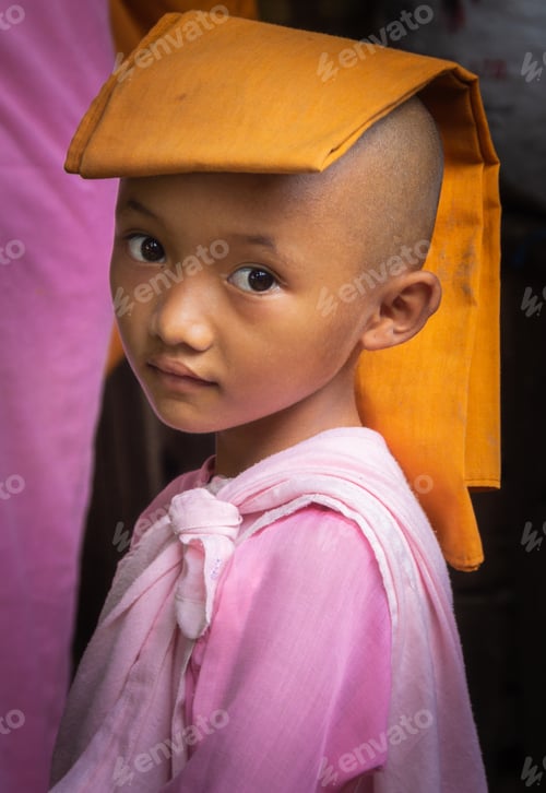 Preview: Mandalay, Myanmar - June, 25 2012: Monk boys in monastery yard