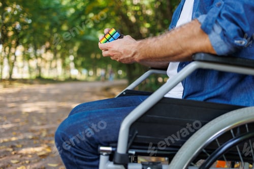 Preview: Rubik's cube fun: Wheelchair user in the park