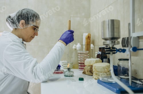 Preview: Medical Science Laboratory: Portrait of Beautiful Black Scientist Looking Under Microscop