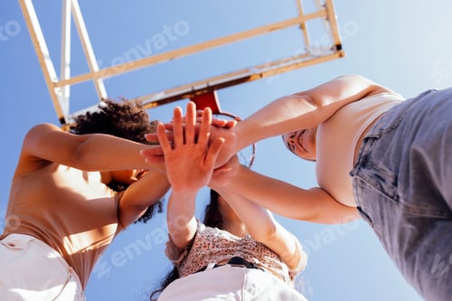 Preview: Stylish cool teen girls gathering at basketball court, friends playing basketball outdoors