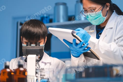 Preview: researcher working in laboratory for medicals science research using scientific equipment technology