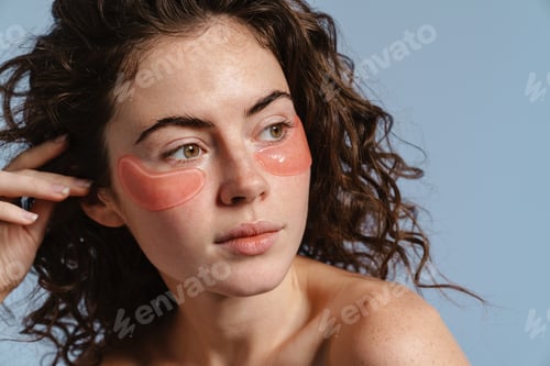 Preview: Beautiful half-naked nice girl posing with eye patches