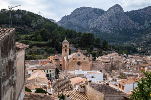 Preview: Scenic view of Banyola small town between mountains in Mallorca.