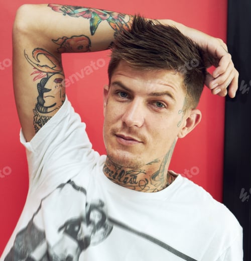 Preview: Proud to be an individual. Portrait of a handsome young man showing the tattoos on his arms.