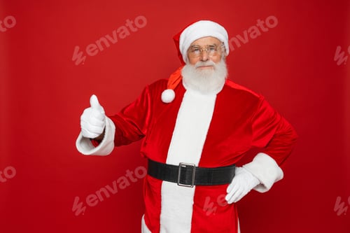 Preview: Santa Claus demonstrate thumb up chrismas new year ad promotion isolated on red color background