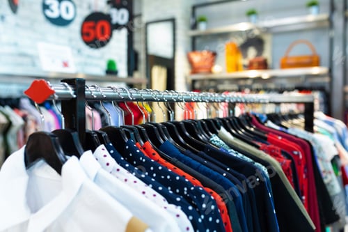 Preview: Fashionable dresses in polka dots on clothing garmet rack