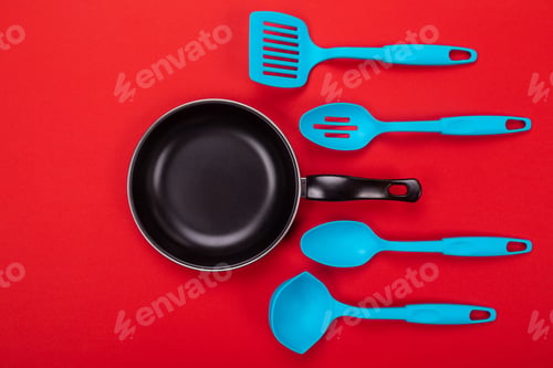 Preview: Kitchen utensils for cooking in kitchen isolated with copyspace on red background