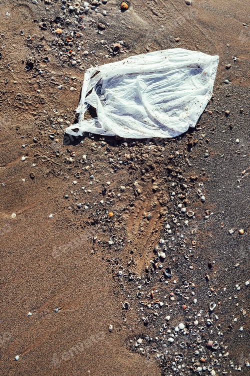 Preview: plastic bag thrown on the sand of the beach