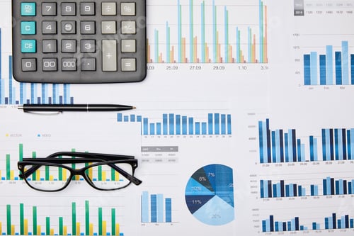 Preview: top view of papers, pen, calculator and glasses on table
