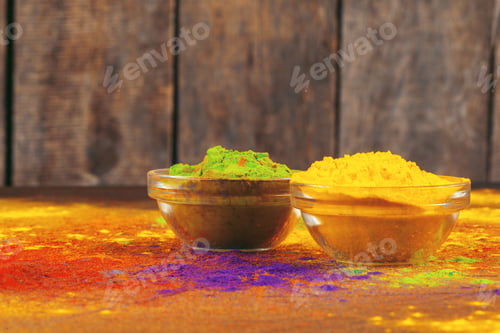 Preview: Bows of colorful Holi power close up on floor