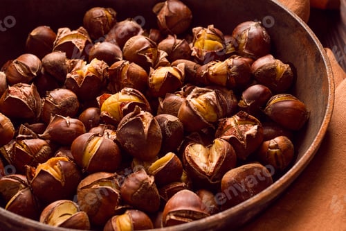 Preview: Roasted chestnuts, in an iron pan, wooden table, top view, no people, rustic style,