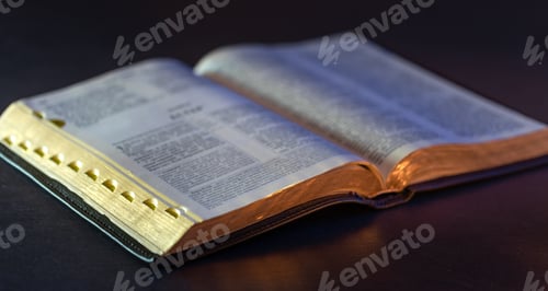 Visualização: Open Holy Bible on the table. Religion concept. Bible on black background.