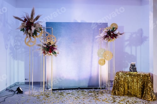 Preview: The festive arch is decorated with flowers, gold glitters and table with a birthday cake for 60