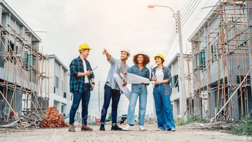 Preview: Team of Construction workers engineers working on site.