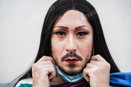 Preview: Drag queen looking at camera while wearing safety mask - Focus on face