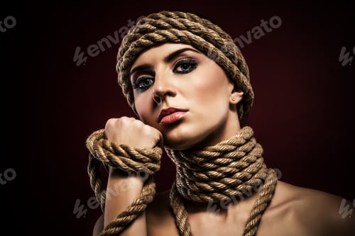 Preview: Portrait of a pretty young woman with ropes