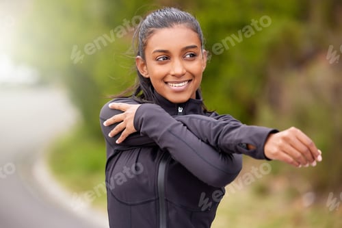 Preview: My own constant source of motivation. Shot of a young woman stretching before a jog.