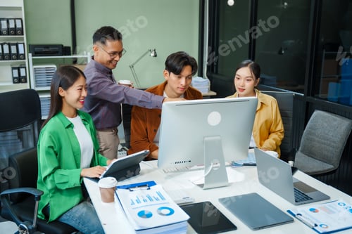 Preview: In a boardroom, an Asian team discusses startup financials and business terms.