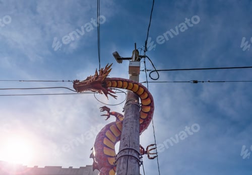 Preview: International district dragon climbing a power pole.