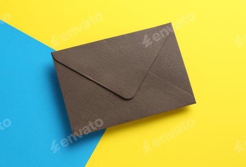 Preview: Beautiful invitation envelope on color background, top view