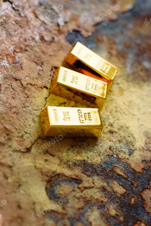 Preview: Gold bars placed on a rusty metal background